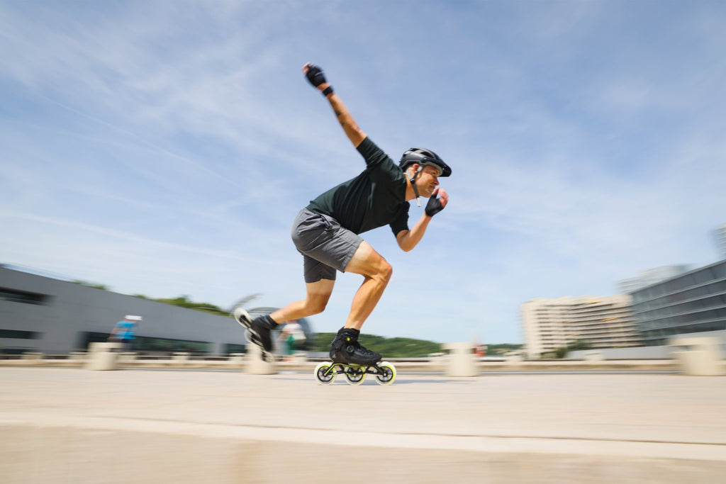 man rollerblading in the city with speed and long distance inline skates