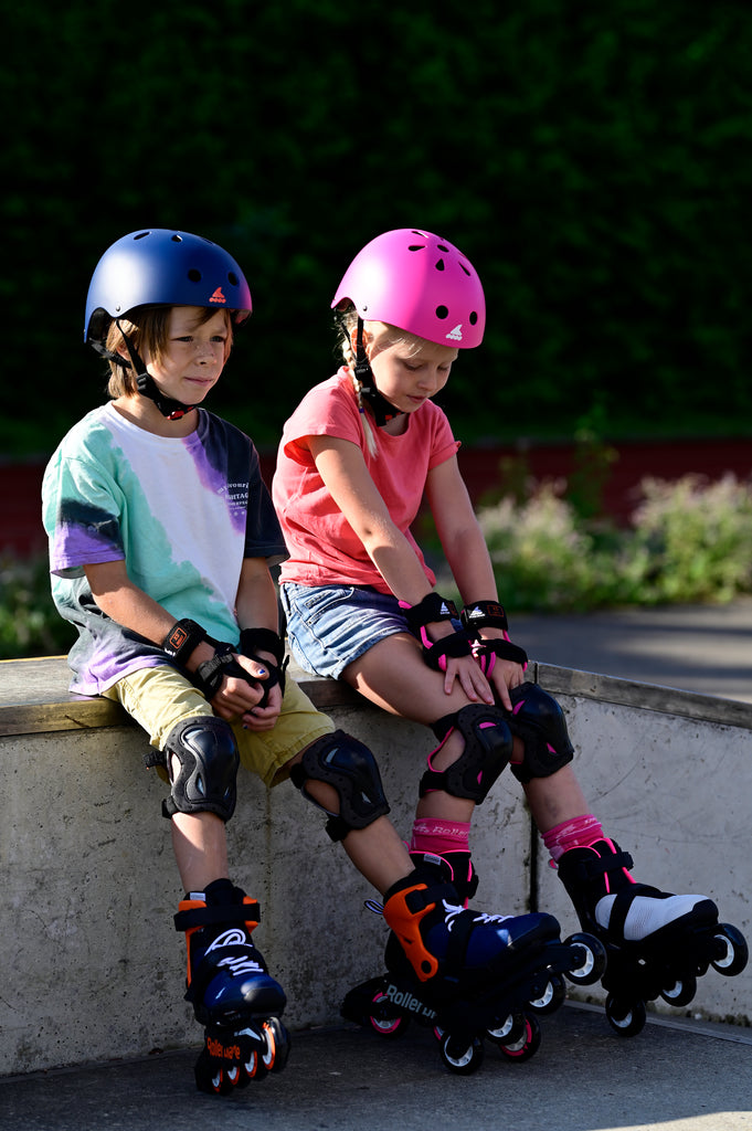 kids with junior inline skates and protective gear